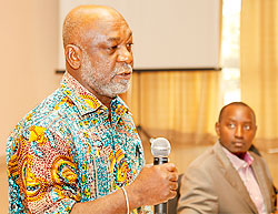 Ghanaian media expert Prof Kwame Karikari (L) with Patrice Mulama, the Executive Secretary of MHC, speaking during the forum yesterday. The New Times Timothy Kisambira