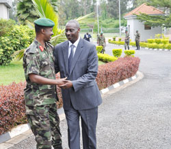 Lt Gen Charles Kayonga (L) greets UPDF chief Gen Aronda Nyakairima yesterday. The New Times / Courtesy