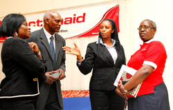 (L-R) Mimi Ladipo WB Country Rep, Dr Alexander Lyambabaje lecturer at NUR, Antonia Mutoro Executive Director of IPAR, and Josephine Uwamariya, Country Director, Action Aid chatting before the meeting. The New Times / Timothy Kisambira