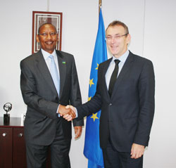 Andris Piebalgs (R), the European Commissioner in charge of development, receives Rwanda's Finance Minister, John Rwangombwa, in Brussels this week.The New Times / File.