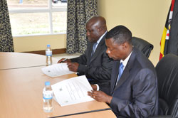 Defence Ministers James (R) Kabarebe and Chrispus Kiyonga during the signing in Musanze yesterday. The New Times / Courtesy