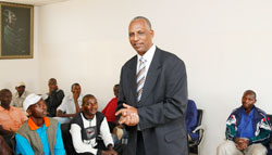 John Sayinzoga, the head of the demobilization commission talking to former soldiers before going for screening. The New Times / Timothy Kisambira