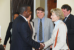  Swiss minister Isabel Rochat chats with MINALOC PS Cyrille Turatsinze as other delegates look on yesterday. The New Times /Courtesy