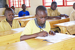  Pupils write their PLE exam. This year's examinations kick off today. The New Times / File photo