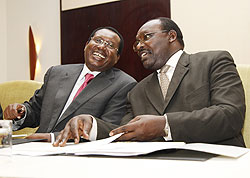 The Minister of Trade and Industry, Franu00e7ois Kanimba (R) shares a light moment with John Bosco Rusagara, the President of FEAFFA. The New Times/T. Kisambira.