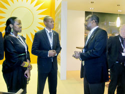 RDB's Patrick Nyirishema(C) and ICT Operations Manager, Paula Ingabire (L) at the Rwanda Stand during the ITU Telecom World, 2011 in Geneva.The NewTimes / Courtesy