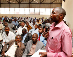 Theogene Batumika, Inspector of Education, Bwira Sector in Ngororero District, speaking during the cooperativeu2019s general assembly. The New Times / T. Kisambira.