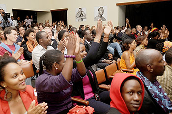 The audience sings along with Maurice Kirya.