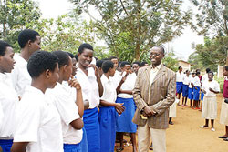 State Minister Mathias Harebamungu with students before commissioning of O Level Exams last year. Students have said they are ready for the examinations tomorrow. The New Times/ File.