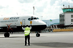 Ground crew directing an aircraft at Kigali International Airport. Lack of requisite aviation skills is cited as a major cause of plane crashes. The New Times/ File.