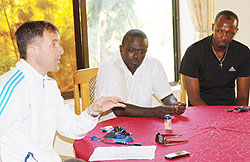Micho addressing the media moments after being named the Amavubi head coach. His assistants are Jean Marie Ntagwabira (C) and Eric Nshimiyimana (R). The New Times / B.Mugabe
