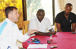 Micho addressing the press moments after being named coach. He will work closely with Jean Marie Ntagwabira (Center) and Eric Nshimiyimana (right).The New Times / B. Mugabe.