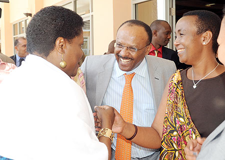 Minister Aloisea Inyumba (R) and UN Assistant Secretary General Tegegnework Gettu (C) talking to Thokozile Ruzvidzo, a participant at the 8th AGF in Kigali yesterday. The New Times / John Mbanda.