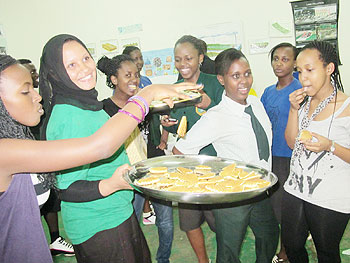 The Cooking Club team makes tasty snacks for sale to help the needy. Photo P. Mbabazi.