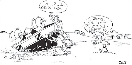 Rescuers lift a lorry that overturned at u201815u2019 (kilometer), along the Kigali-Rwamagana road.