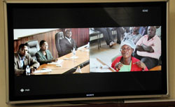 A plantiff from Rusizi District (R) talks to Supreme Court President Aloysie Cyanzayire and other judges in Kigali through video link yesterday. The New Times / John Mbanda.