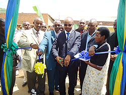 Infrastructure Ministry's Jean de Dieu Hakizimana (C) with Mayor Bernard Kayumba (L) and other local leaders at the launch of SACCO in Karongi. The New Times ./ S Nkurunziza.