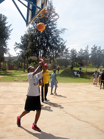 Teenagers playing basketball at last year's camp. The New Times / D. Umutesi