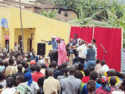 Residents of Mushishiro eagerly watch Bangamwabo actors celebrate unity in a play in Muhanga. The New Times / D. Sabiiti.