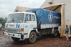 A WFP truck offloads food supplies at a refugee camp in the country. Germany has stepped in to rescue Congolese refugees in Rwanda. The New Times / File.