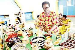 A trader displays her artefacts during the ongoing Culture Week in Kigali. Exhibitors are optimistic of doing roaring business. The New Times / J. Mbanda