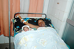 A mother with her baby after giving birth. The number of women overlooking antenatal care is still high.The New Times/ File.