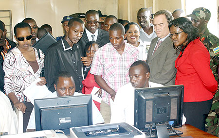 Monique Mukaruriza (right, in red) together with other officials during a tour of customs offices at the Gatuna border post.The New Times / F. Ndoli