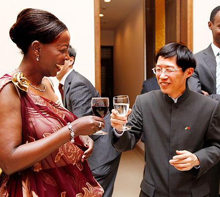 Foreign Affairs Minister Louise Mushikiwabo makes a toast with Chinese ambassador to Rwanda Shu Zhan at the 40th anniversary celebrations in Kigali. The New Times / Timothy Kisambira.