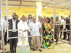 Prime Minister Pierre Damien Habumuremyi (C) flanked by Eastern Province governor, Odette Uwamariya (R) during a tour of the Nyagatare milk plant on Monday.the New Times / D Ngabonziza