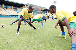 Amavubi players stretching during a training session. The New Times/T. Kisambira.
