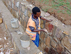 Women have not been left behind in jobs previously reserved for men like construction. Minister Aloisea Inyumba has challenged them to be confident. The New Times / File.