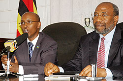 ICT Minister Dr Ignace Gatare (L) and his Ugandan counterpart Dr Ruhakana Rugunda during their meeting in Kampala yesterday. The New Times / Courtesy.