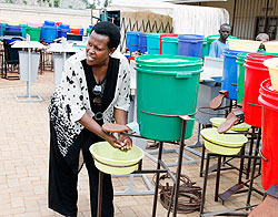 City Vice Mayor Hope Tumukunde washing hands. The New Times / T. Kisambira