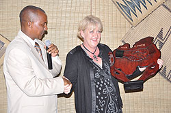 Karongi Mayor Bernard Kayumba hands a gift to the Mayor of Dieulefit District in France Christine Prietto as a sign of unity. The New Times / Sam Nkurunziza.
