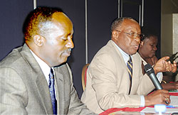 NURC President Bishop  John Rucyahana (R) speaks at the meeting, flanked by the the Commission Executive Secretary, Dr Jean Baptiste Habyalimana. The New Times / John Mbanda.
