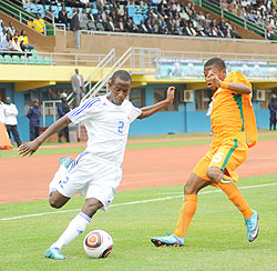 Rusheshangoga takes on an Ivory Coast player during the 2011 CAF U-17 Africa championship. The youngster has been drafted into the senior side. The New Times / File. 