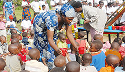 Children being served porridge. Various efforts have seen the lives of children improved. The New Times / File.