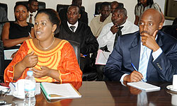 MINEDUC Director of Finance Marie Claire Mukayisa (L) gives an explanation before the PAC as OLPC coordinator Nkubito Bakuramutsa  looks on. The New Times/  J. Mbanda.