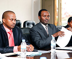 MINICOM PS, Emmanuel Hategeka (R) alongside the director of finance African Gatera, before the PAC at parliament buildings yesterday.  The New Times / T. Kisambira