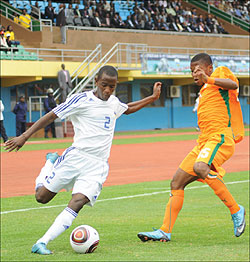 Rusheshangoga takes on an Ivory Coast player during the 2011 Africa U-17 Championship. The youngster has been called up to replace Gabriel Mugabo in Dar es Salaam. The New Times / File.