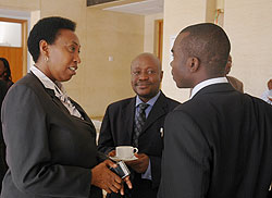 Hon. Patricia Hajabakiga (L), Hon.Mike Sebalu both from EALA and  Prudence Sebahizi chat during a recent  meeting in Kigali. The New Times / File.