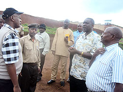 James Mwanje (R), Emmanuel Rukundo (L) with other members of the Ugandan delegation during their tour of Butare prison on Tuesday. The New Times /J.P Bucyensenge