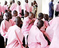 Suspects of Grenade attacks chat during the break at the High Court in Kigali . The New Time / T. Kisambira