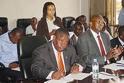 Northern Province Executive Secretary, Deo Kabagamba (R), Governor Aime Bosenibamwe and Accountant Julienne Mukandoli (standing) before the PAC at parliament buildings, yesterday. The New Times / J. Mbanda.