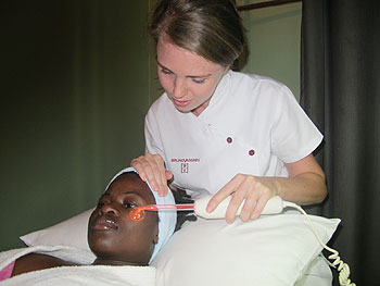 Beautician Anke Candaele doing a facial treatment. The New Times / D.Umutesi