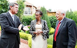 Decio M. Ripandelli, Head Biosafety Unit (L), Marie Christine Gasingirwa of MINEDUC (C) and Mike Hughes, an advisor at MINEDUC chatting yesterday. The New Times / Timothy Kisambira.