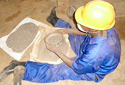 A miner at a Nemba site sorting cassiterite. The new firm will add value to the ore. The New Times /File.