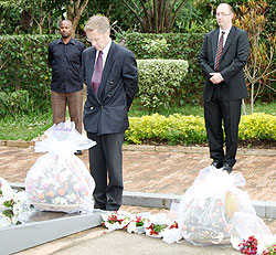 DFID Acting Director for East and Central Africa Donal Brown (c), pays tribute to Genocide Victims at Kigali Memorial Centre as UK High Commissioner to Rwanda, Ben Llewellyn-Jones (R), looks on. The New Times/ Courtsey.