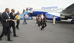 Minister of Infrastructure Albert Nsengiyumva and Rwandair's John Mirenge at the inauguration of the New Boeing Sky Interior. The company has launched direct flights to Nigeria. The New Times/ File.