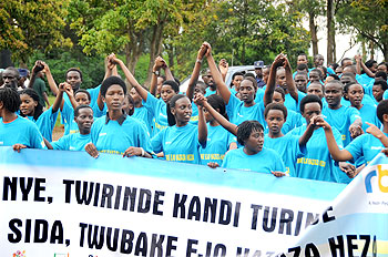 Rwandan youth march to Amahoro Stadium during the World AIDS Day on December 1. The New Times / File.